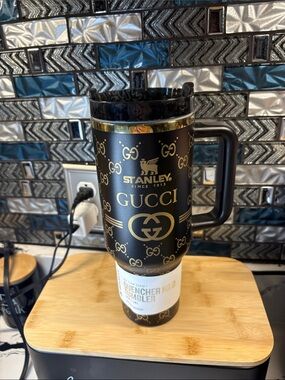 Gucci Black and Gold Logo Travel Mug